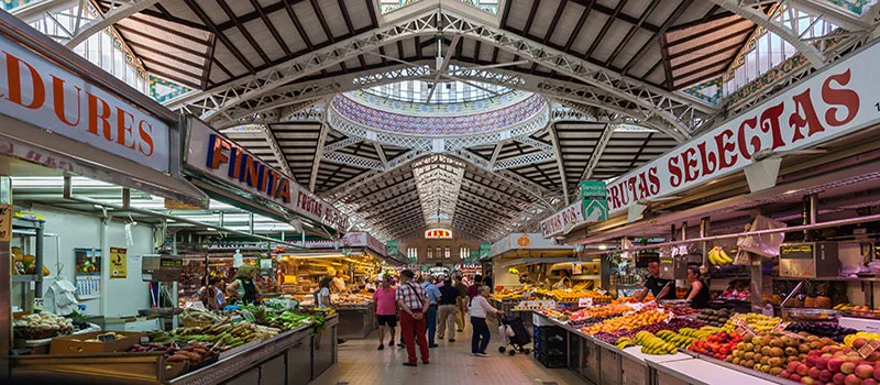 The unique architectural ceiling of the Central Market of Alicante, showcasing intricate structural details and a blend of historical and modern design elements that highlight the market's rich heritage.